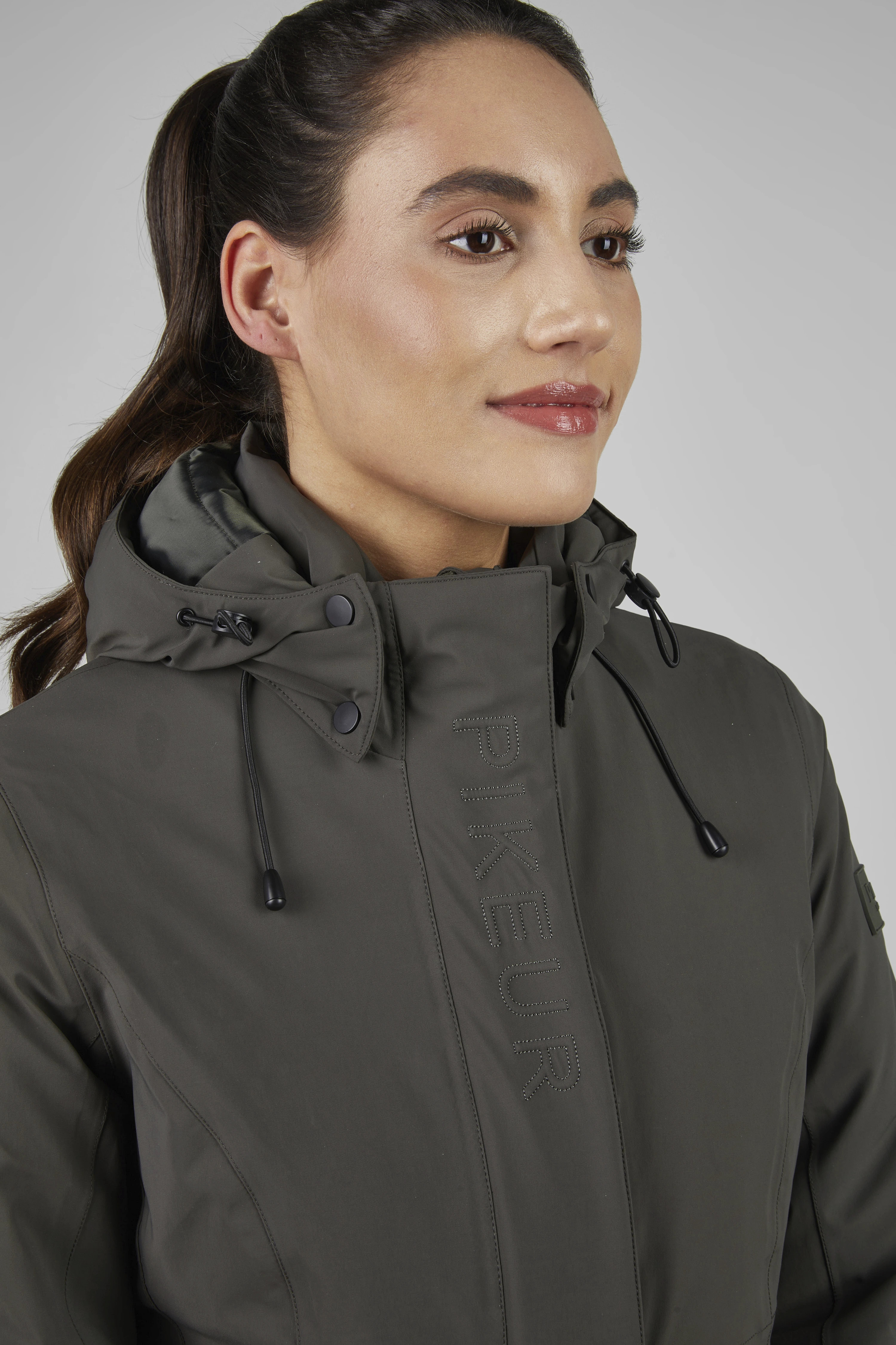 Shop Pikeur Waterproof Jacket Deep Khaki | Waterproof & Breathable | Perfect for Active Riders Shop Pikeur Waterproof Jacket Deep Khaki | Waterproof & Breathable | Perfect for Active Riders